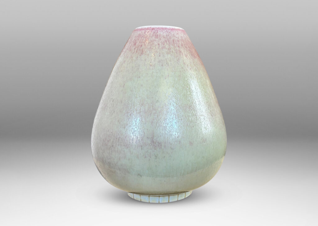 Gallery BAC bulbous form on a notched disk reveal, glazed in ochre-tan and hints of burnt sienna