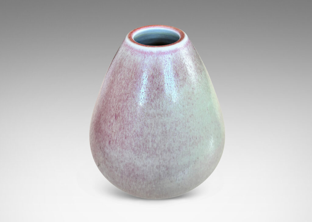 Gallery BAC bulbous form on a notched disk reveal, glazed in ochre-tan and hints of burnt sienna