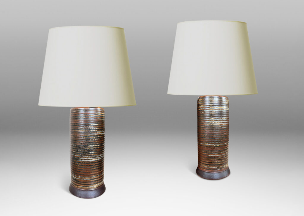 Gallery BAC ridged cylindrical forms glazed in a warm brown and pale gray “Sung” glaze, with matte brown angled plinths