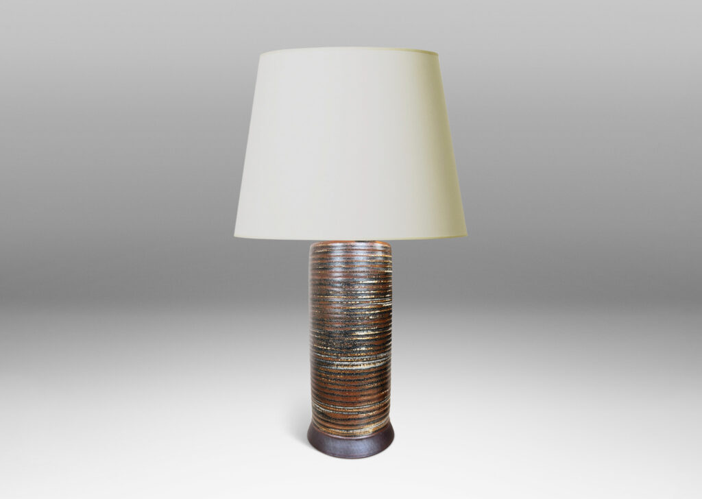 Gallery BAC ridged cylindrical forms glazed in a warm brown and pale gray “Sung” glaze, with matte brown angled plinths