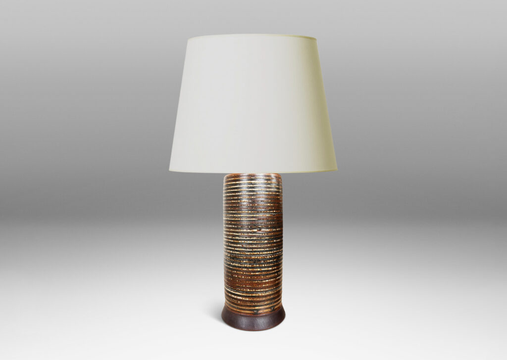 Gallery BAC ridged cylindrical forms glazed in a warm brown and pale gray “Sung” glaze, with matte brown angled plinths