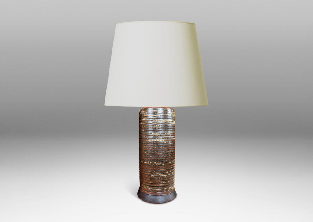 Gallery BAC ridged cylindrical forms glazed in a warm brown and pale gray “Sung” glaze, with matte brown angled plinths