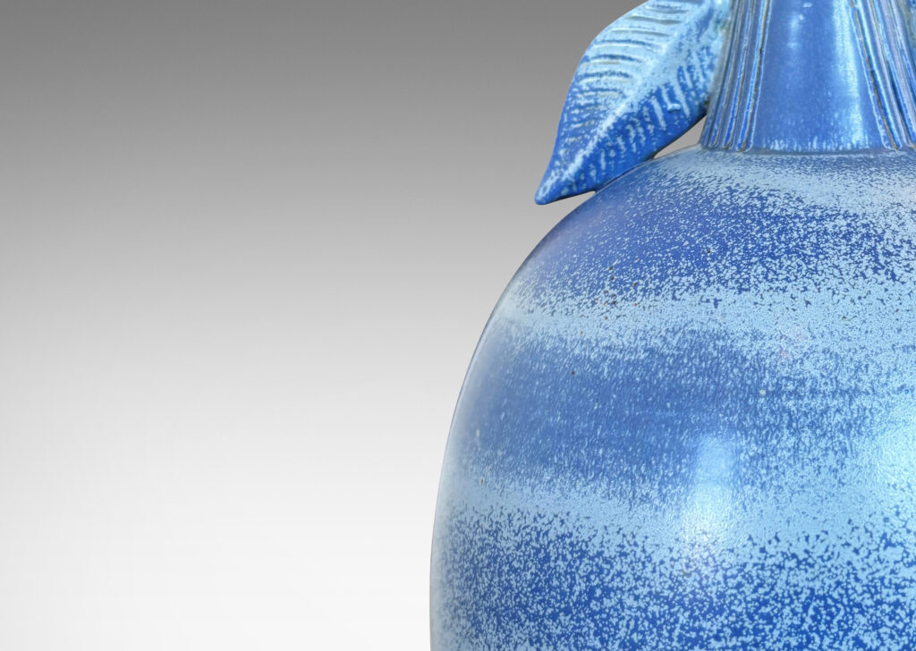 Gallery BAC ovoid forms with stem-like neck and leaves in high relief, glazed in light to deep tonal French blue