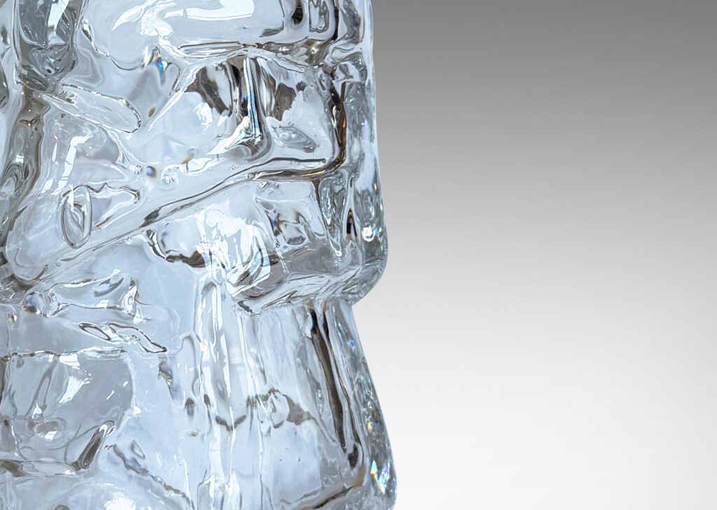 Gallery BAC tall cylindrical form mold-blown with a rock-like relief; glass