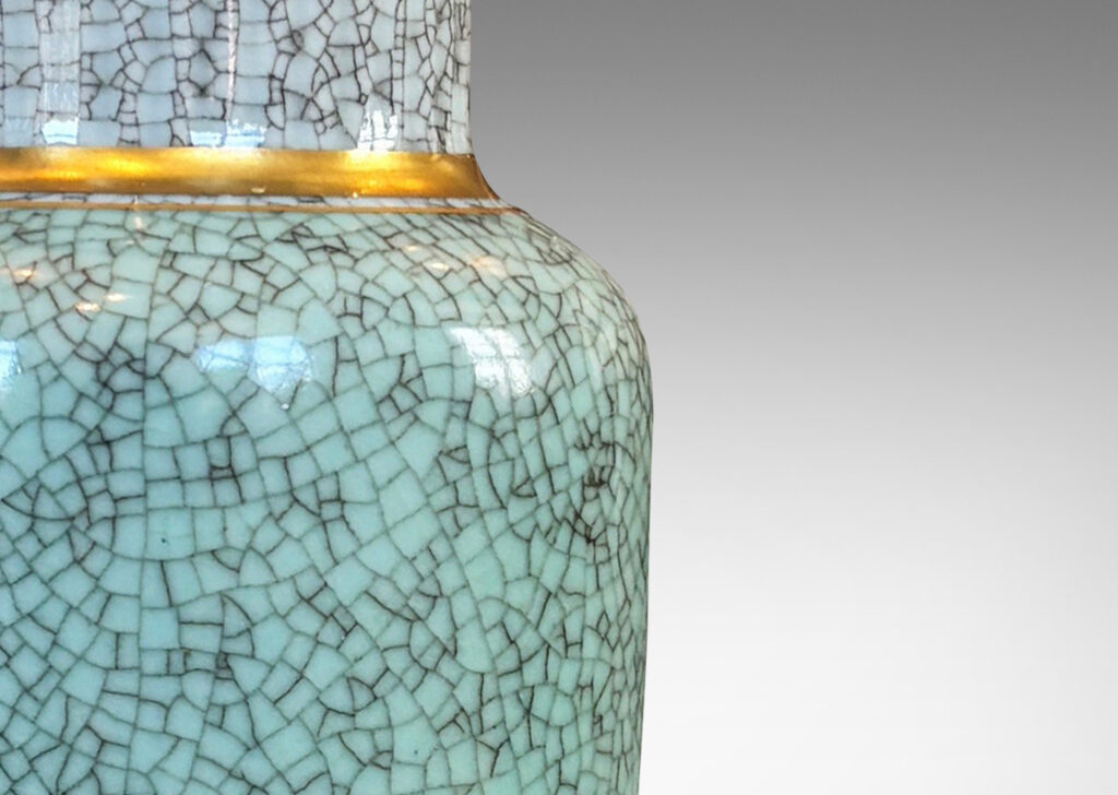Gallery BAC tapered form with wide mouth and articulated lip, glazed in craquel celadon and pale gray, with gilded details
