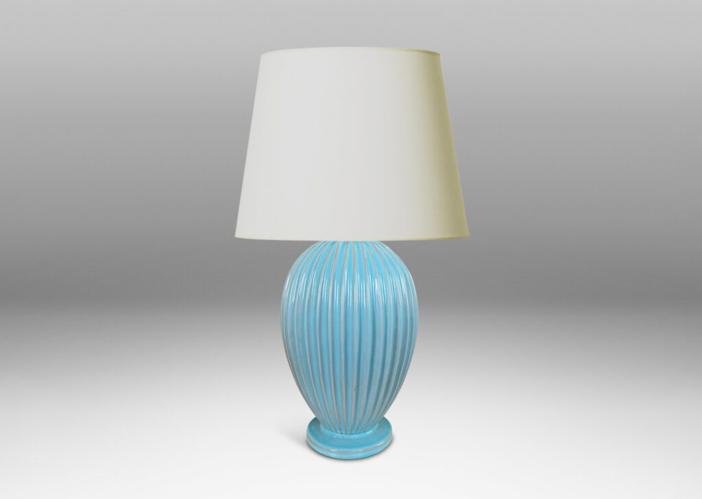 Gallery BAC fluted balloon form on a disk plinth, glazed in semi-shine light blue