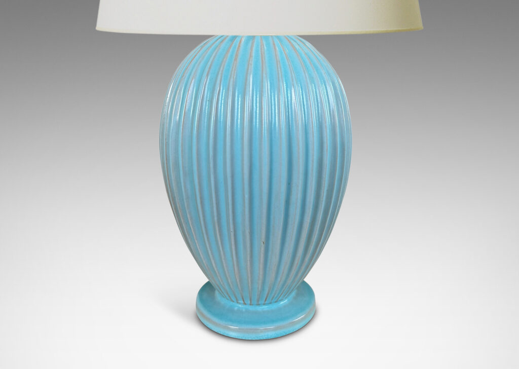 Gallery BAC fluted balloon form on a disk plinth, glazed in semi-shine light blue