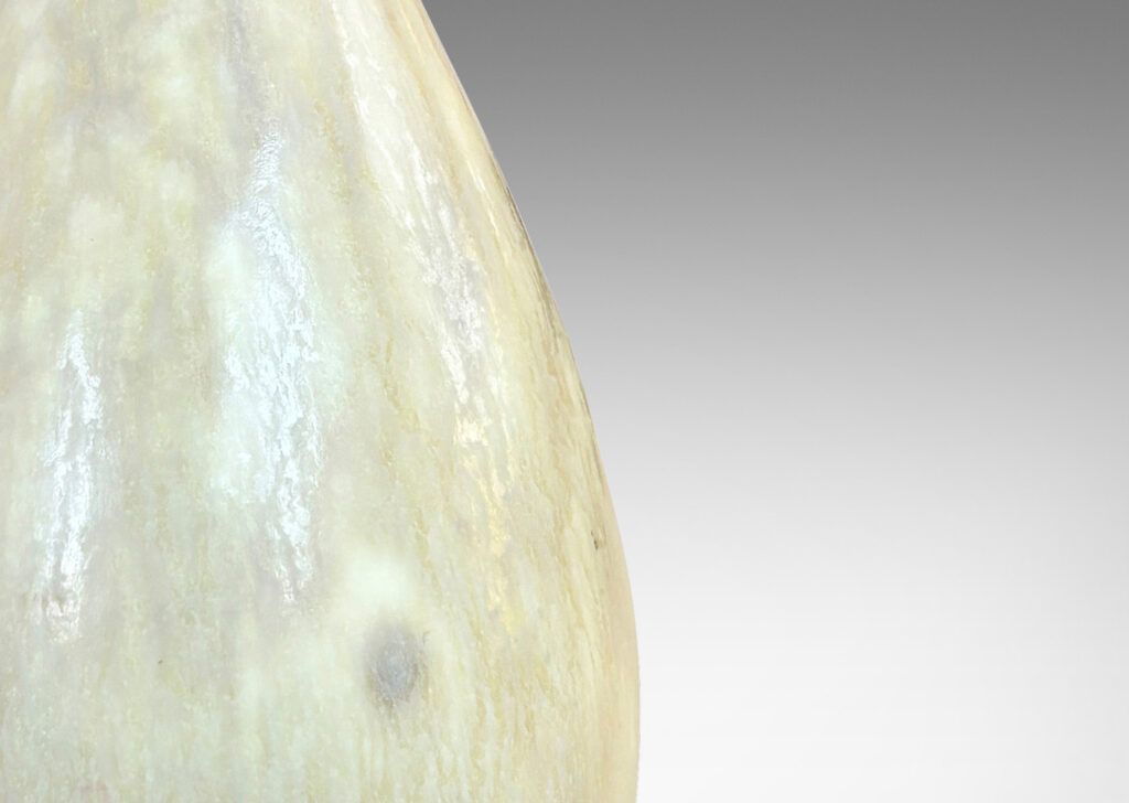 Gallery BAC sinuous swelling form with delicately flared neck, glazed in a flowing yellow-tan