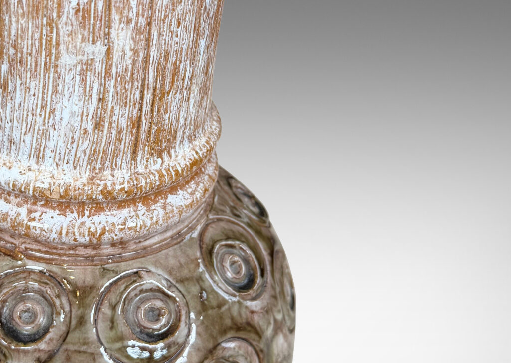 Gallery BAC plump globe forms with carved circle motifs glazed in shiny olive green-gray, and wide textured necks in partial white glaze