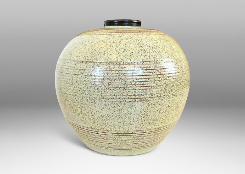 Gallery BAC tapered globe form with bands of grouped pinstripes and a short cuff neck, glazed in butter yellow with brown speckling