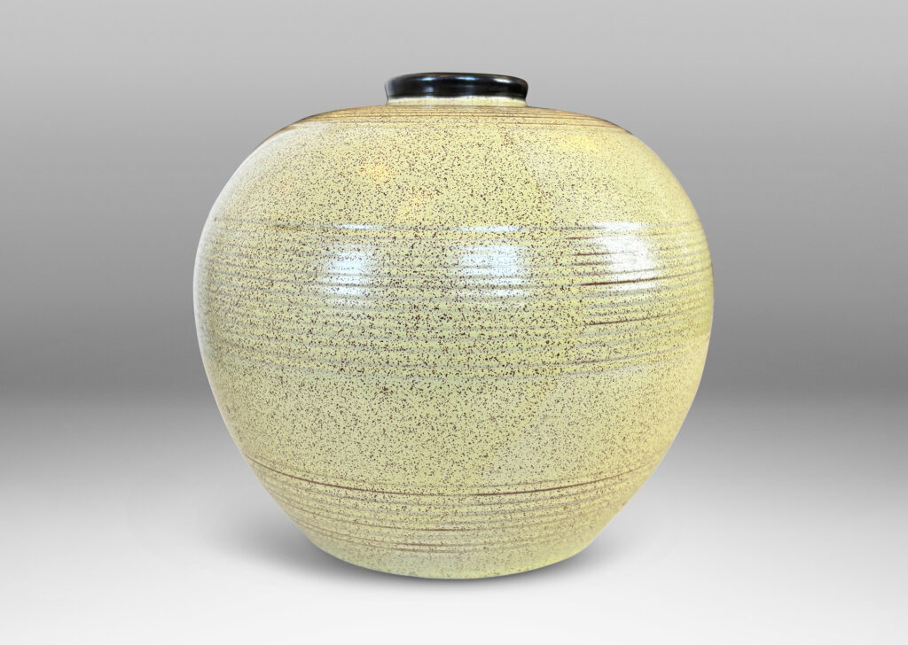 Gallery BAC tapered globe form with bands of grouped pinstripes and a short cuff neck, glazed in butter yellow with brown speckling