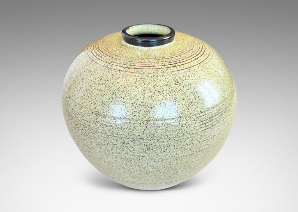 Gallery BAC tapered globe form with bands of grouped pinstripes and a short cuff neck, glazed in butter yellow with brown speckling