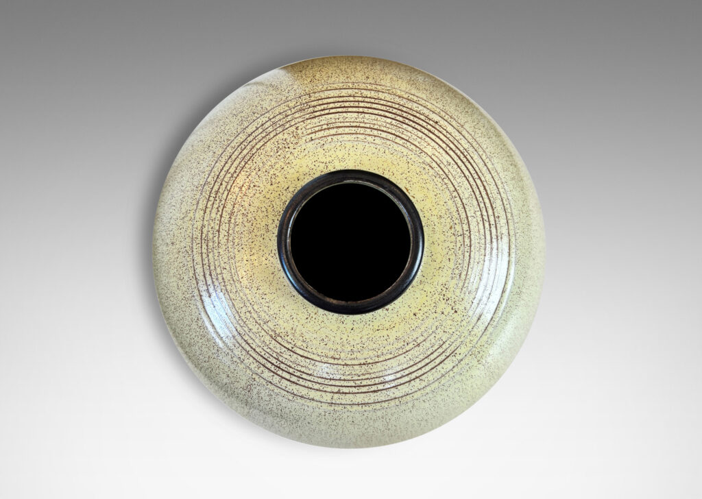 Gallery BAC tapered globe form with bands of grouped pinstripes and a short cuff neck, glazed in butter yellow with brown speckling