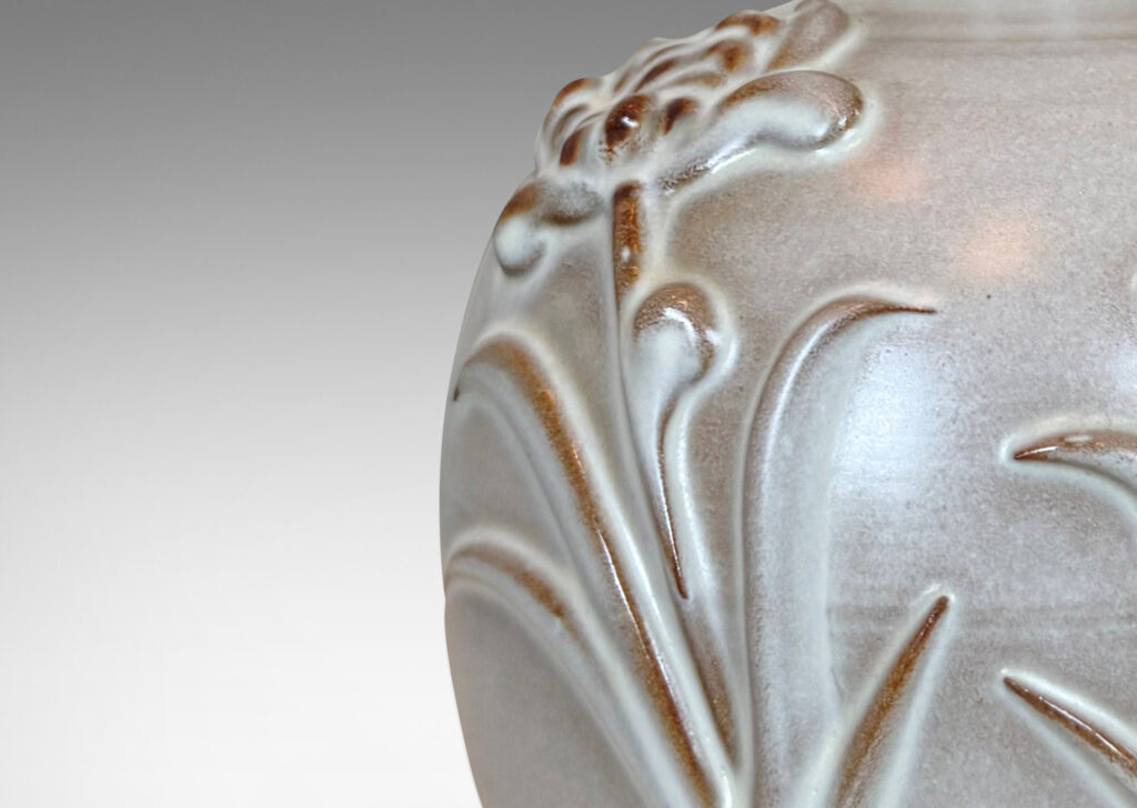 Gallery BACplump globe forms with relief pairs of flowers, lightly glazed in white
