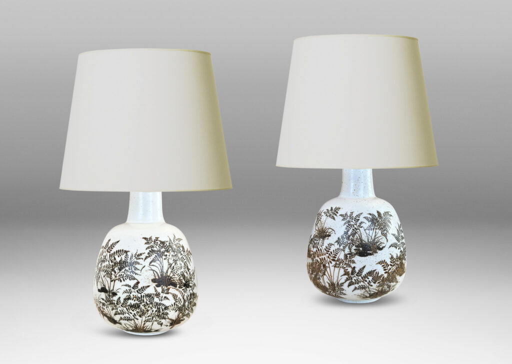Gallery BAC compressed ovoid forms with necks, glazed in white with fern silhouette decorations in brown