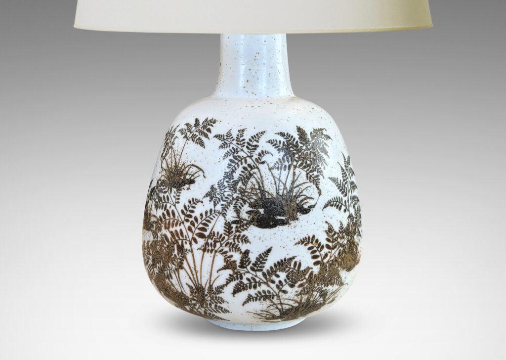 Gallery BAC compressed ovoid forms with necks, glazed in white with fern silhouette decorations in brown