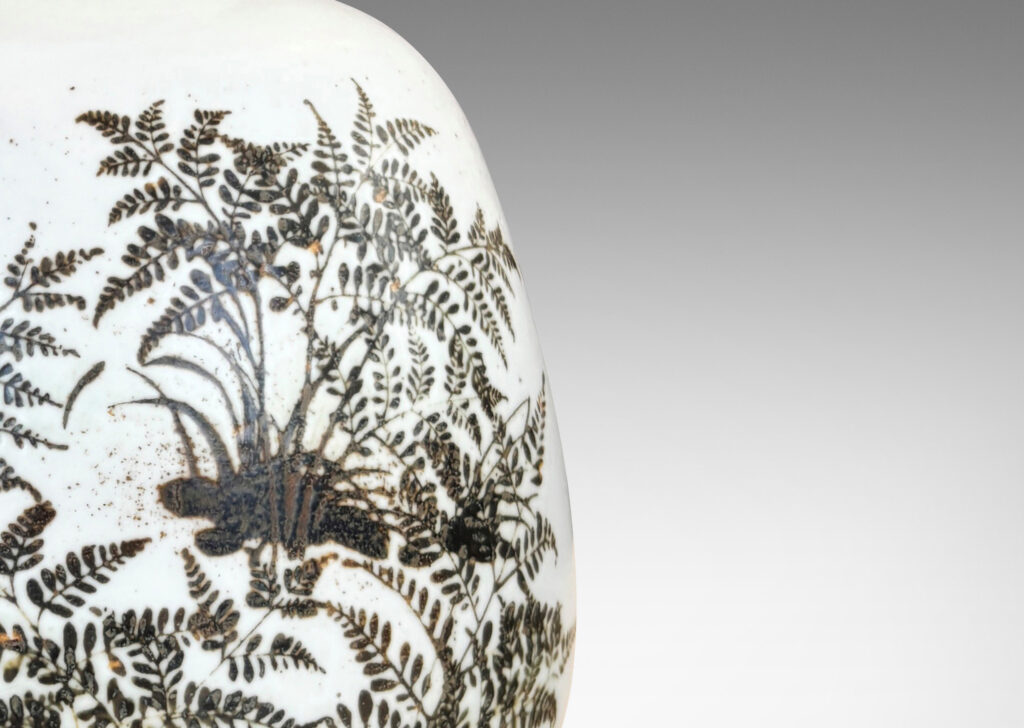 Gallery BAC compressed ovoid forms with necks, glazed in white with fern silhouette decorations in brown