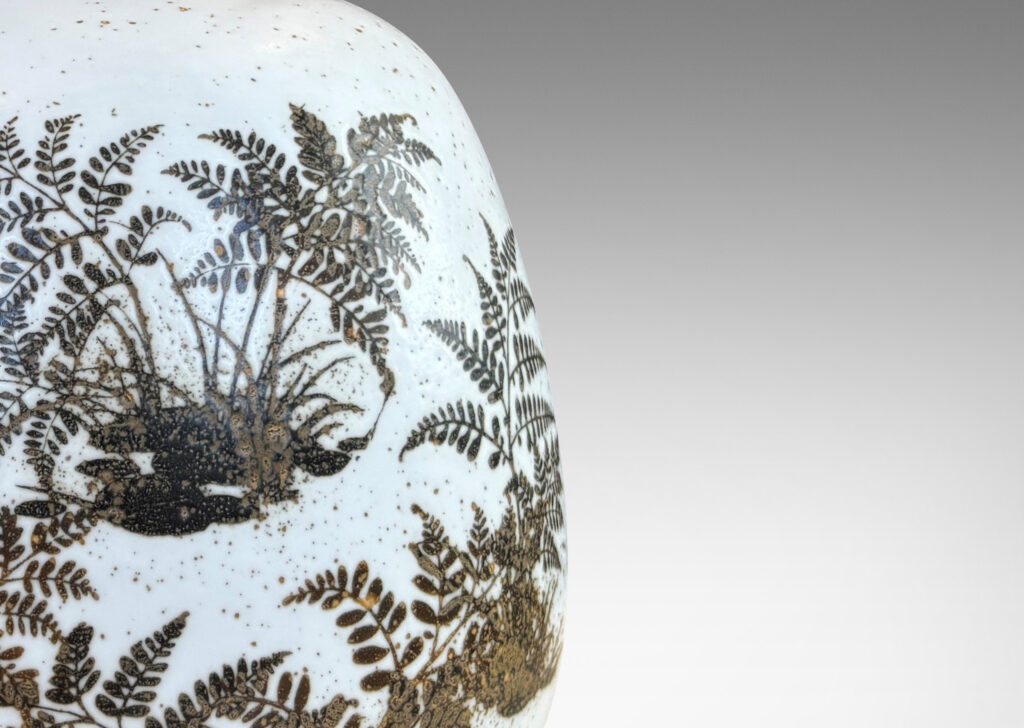 Gallery BAC compressed ovoid forms with necks, glazed in white with fern silhouette decorations in brown