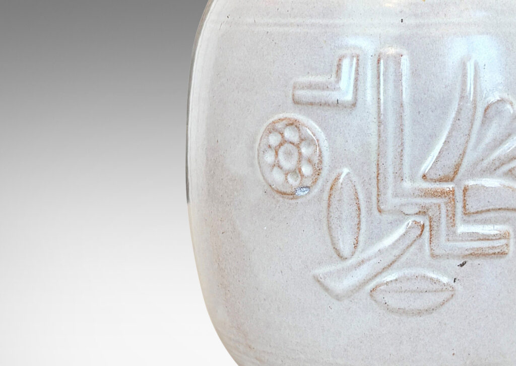 Gallery BAC ovoid form with relief abstract floral design, glazed in ivory and burnt orange