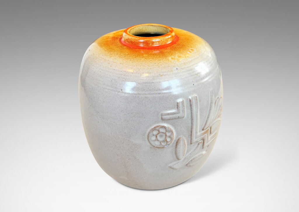 Gallery BAC ovoid form with relief abstract floral design, glazed in ivory and burnt orange