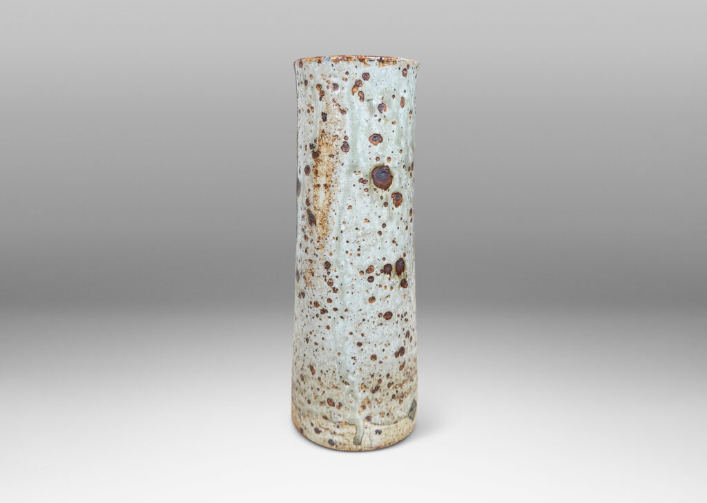 Gallery BAC all cylindrical form glazed in a shiny gray-green with brown speckles