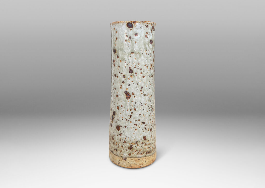 Gallery BAC all cylindrical form glazed in a shiny gray-green with brown speckles
