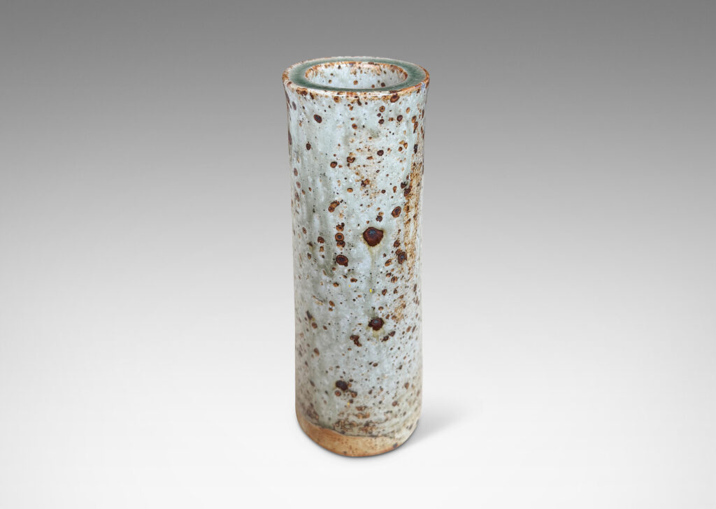 Gallery BAC all cylindrical form glazed in a shiny gray-green with brown speckles