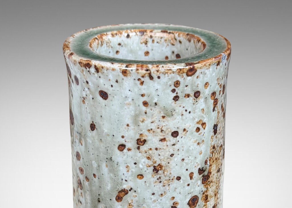 Gallery BAC all cylindrical form glazed in a shiny gray-green with brown speckles