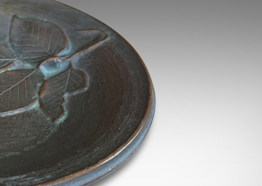 Gallery BAC bowl with painterly texture and naturalistic leaf cluster in relief