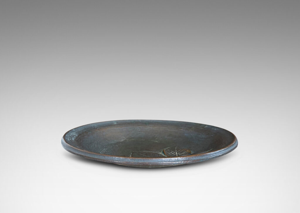 Gallery BAC bowl with painterly texture and naturalistic leaf cluster in relief
