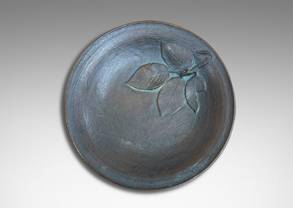 Gallery BAC bowl with painterly texture and naturalistic leaf cluster in relief