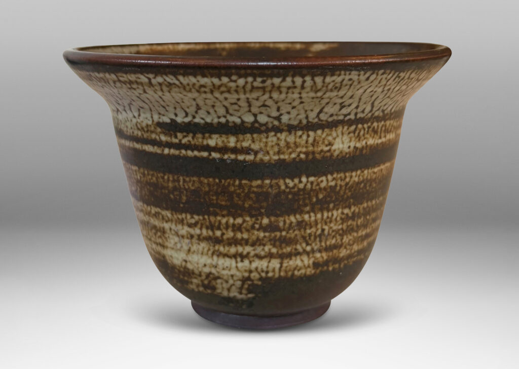 Gallery BAC elegant deep form with flaring lip, glazed in a striae brown and pale gray “Sung” glaze
