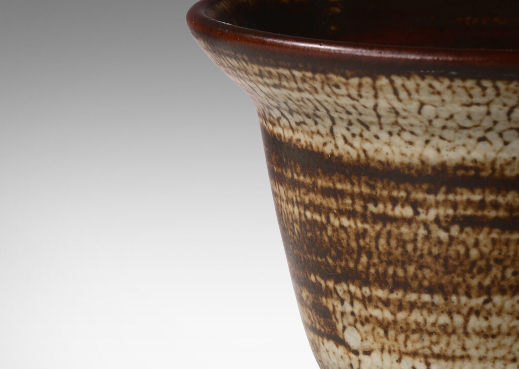 Gallery BAC elegant deep form with flaring lip, glazed in a striae brown and pale gray “Sung” glaze