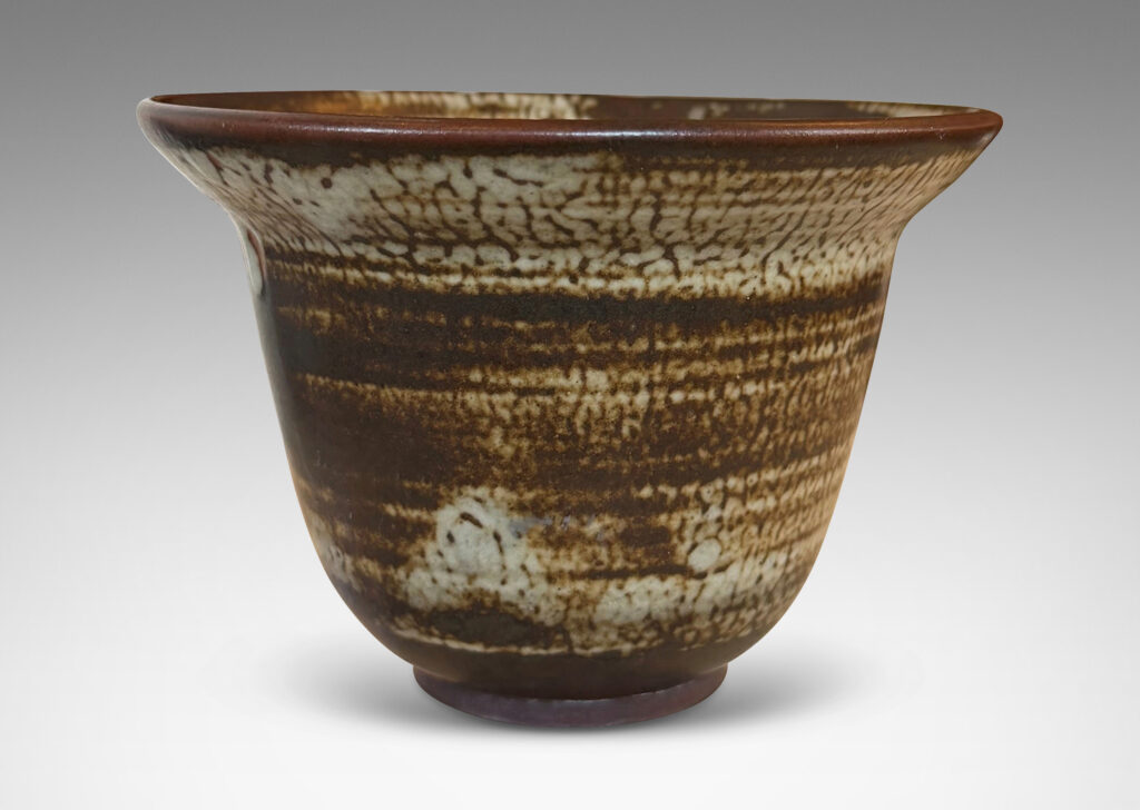 Gallery BAC elegant deep form with flaring lip, glazed in a striae brown and pale gray “Sung” glaze