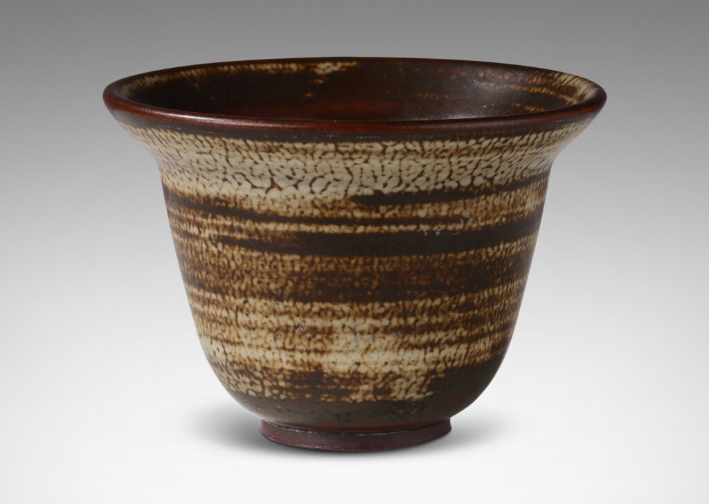 Gallery BAC elegant deep form with flaring lip, glazed in a striae brown and pale gray “Sung” glaze