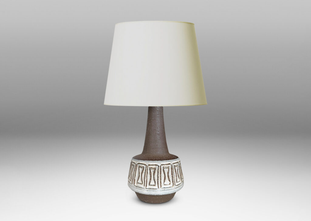 Gallery BAC drum forms with relief hourglass motifs and conical necks, glazed in matte brown