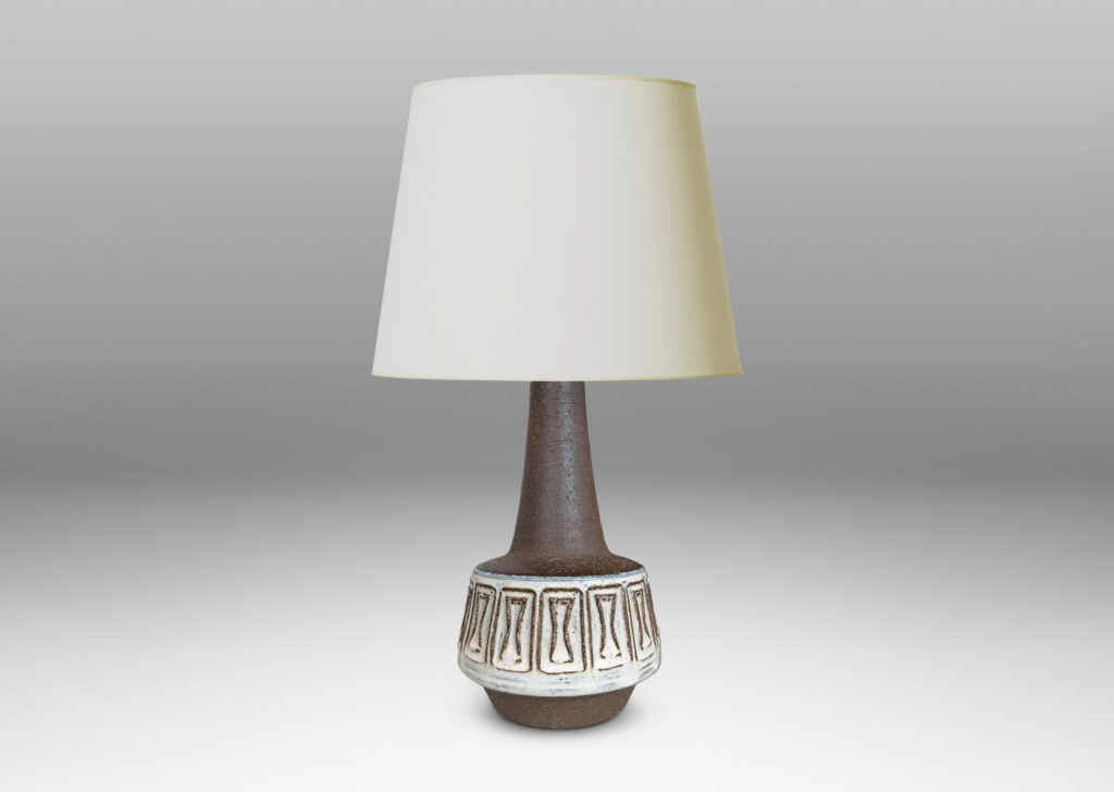Gallery BAC drum forms with relief hourglass motifs and conical necks, glazed in matte brown