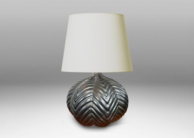 Gallery BAC lobed pumpkin form with ridged chevron reliefs, glazed in a black luster
