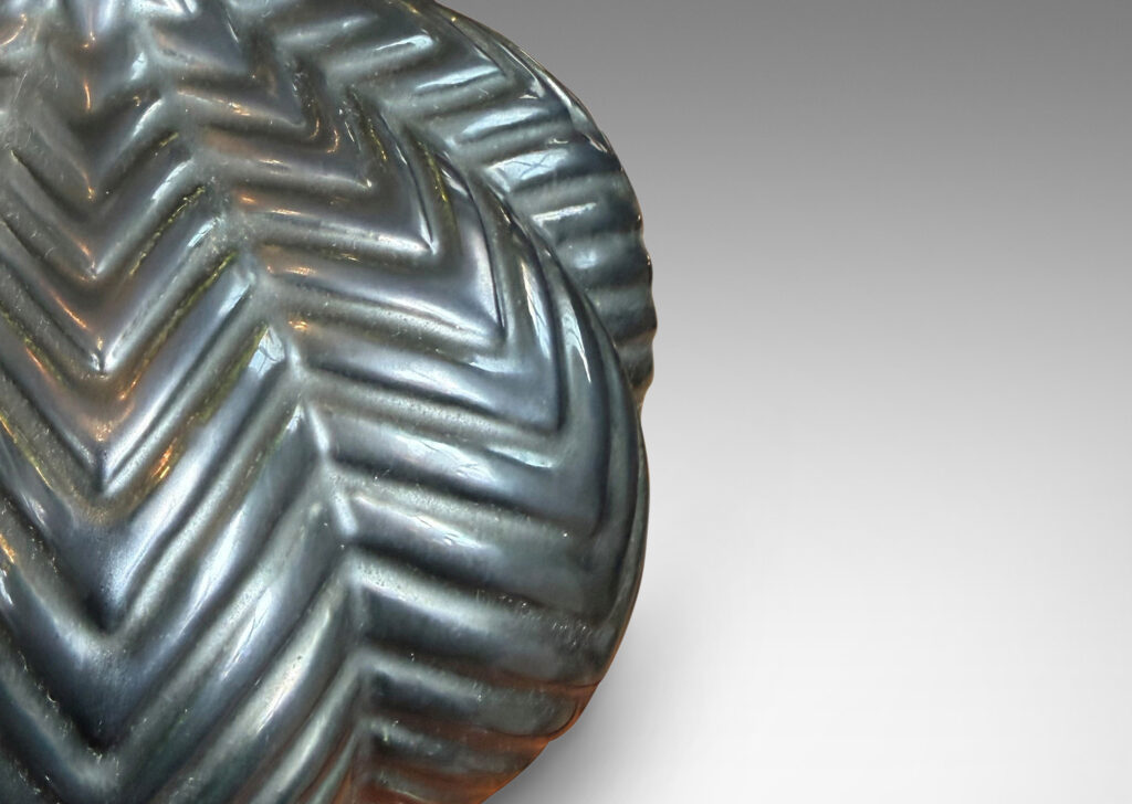 Gallery BAC lobed pumpkin form with ridged chevron reliefs, glazed in a black luster