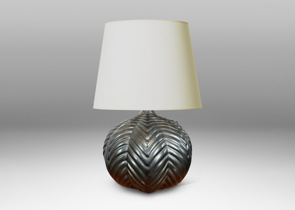 Gallery BAC lobed pumpkin form with ridged chevron reliefs, glazed in a black luster