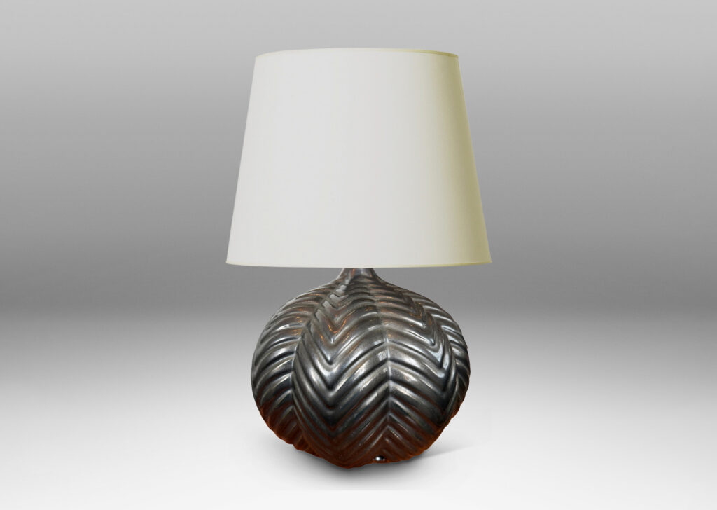 Gallery BAC lobed pumpkin form with ridged chevron reliefs, glazed in a black luster