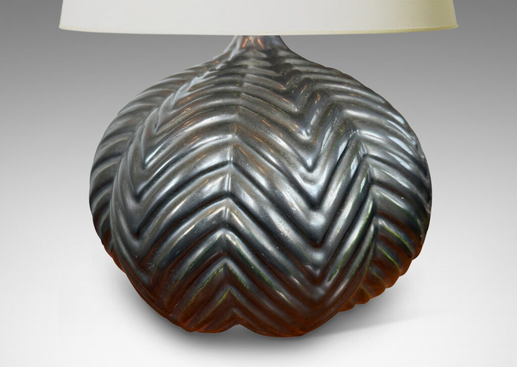 Gallery BAC lobed pumpkin form with ridged chevron reliefs, glazed in a black luster