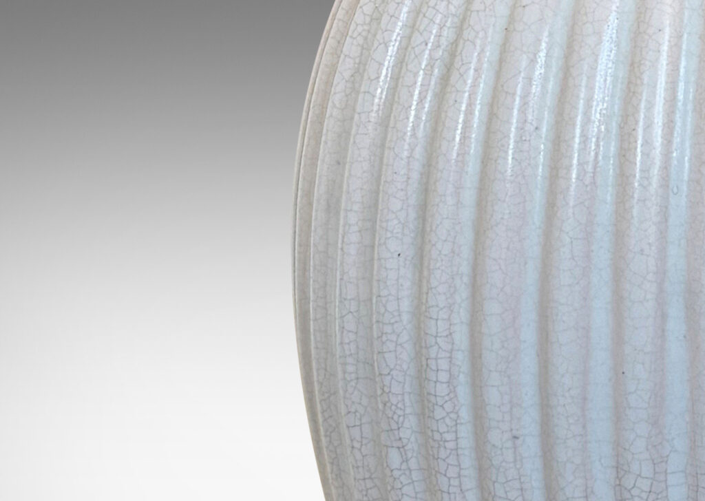 Gallery BAC ribbed ovoid form with wide outstretched mouth, glazed in a semi-shine off-white glaze