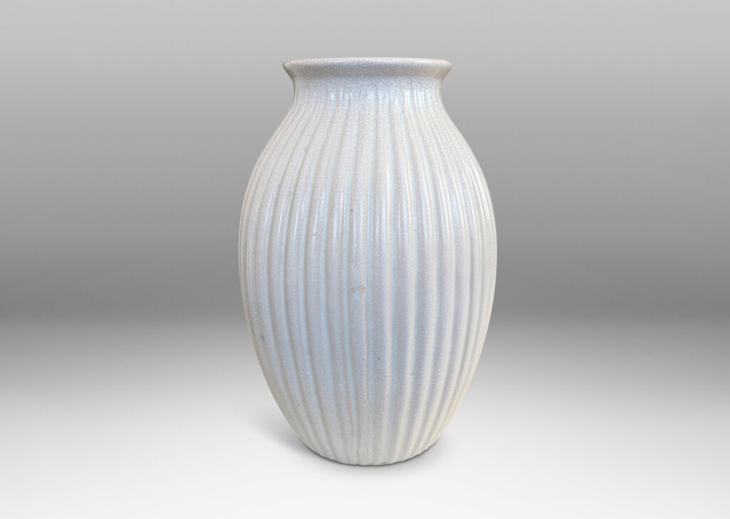 Gallery BAC ribbed ovoid form with wide outstretched mouth, glazed in a semi-shine off-white glaze