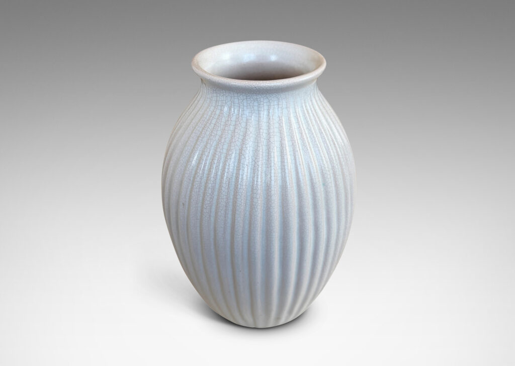 Gallery BAC ribbed ovoid form with wide outstretched mouth, glazed in a semi-shine off-white glaze