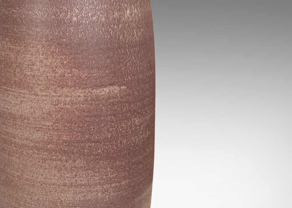 Gallery BAC tall ovoid form with flared mouth and neck, glazed in dark and cocoa brown