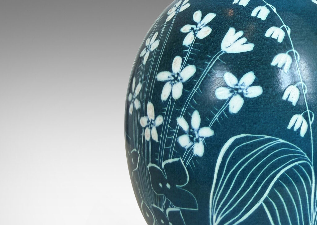 Gallery BAC ovoid form, glazed in turquoise with painterly wildflower designs in white