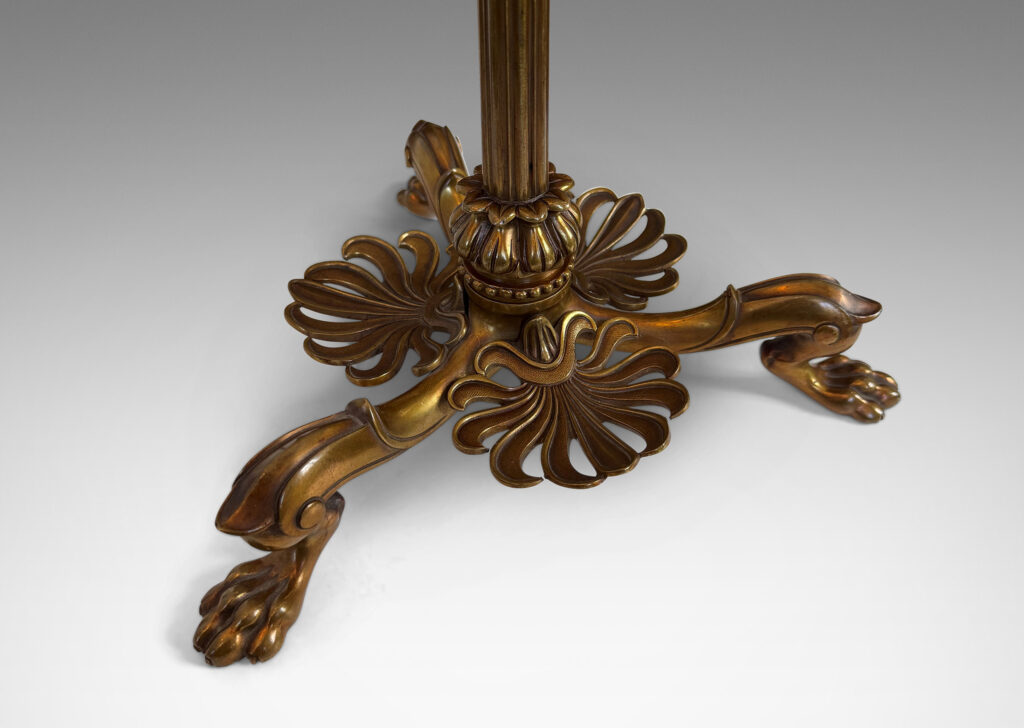 Gallery BAC fluted column stand on a tripod base in the form of springing lion feet with floating anthemia