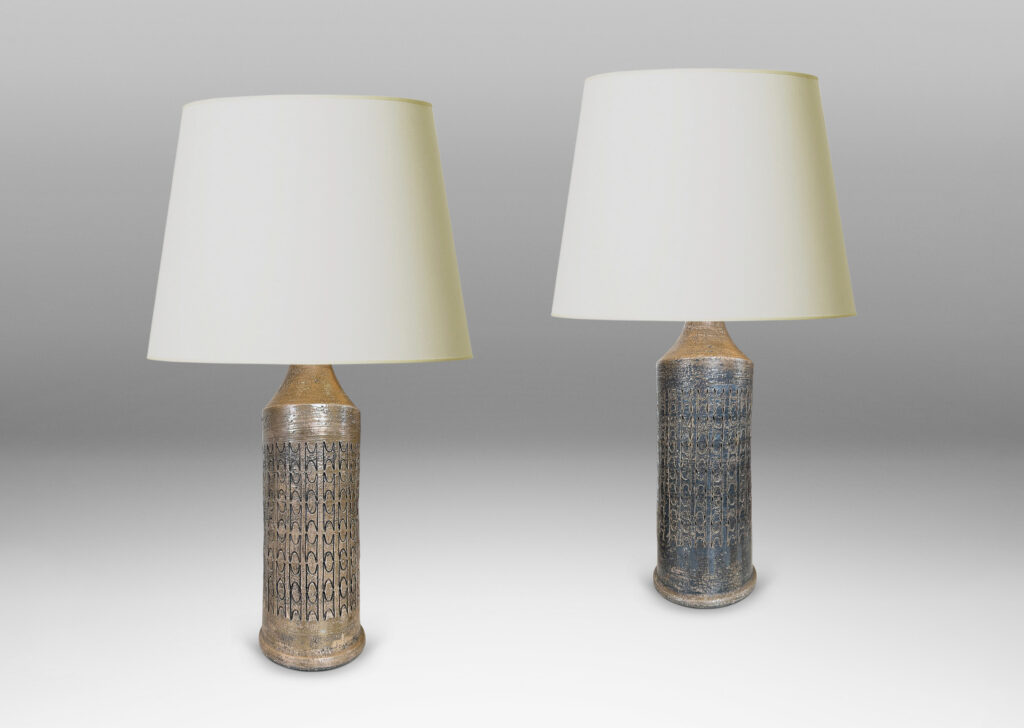 Gallery BAC columnar forms with carved ornamental motifs, glazed in a lightly lustrous grey-brown