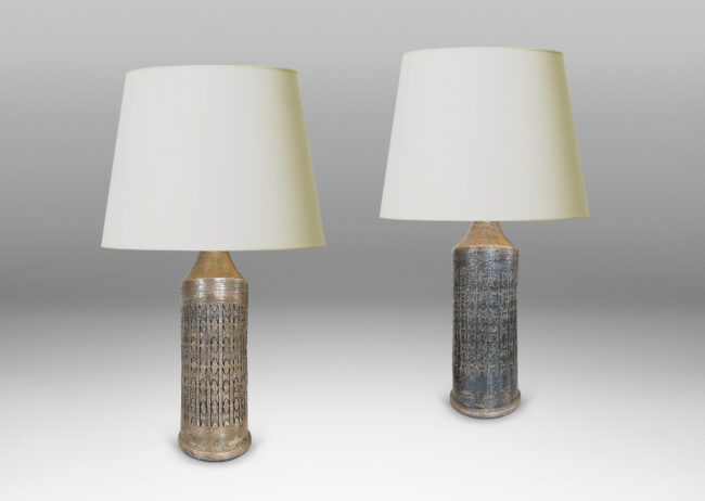 Gallery BAC columnar forms with carved ornamental motifs, glazed in a lightly lustrous grey-brown